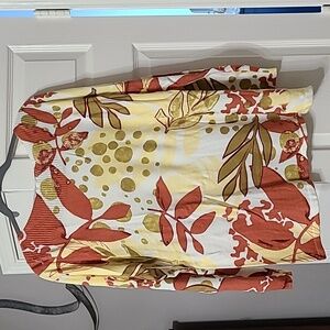 Soft Surroundings sweater, yellow, olive, rust on a cream background